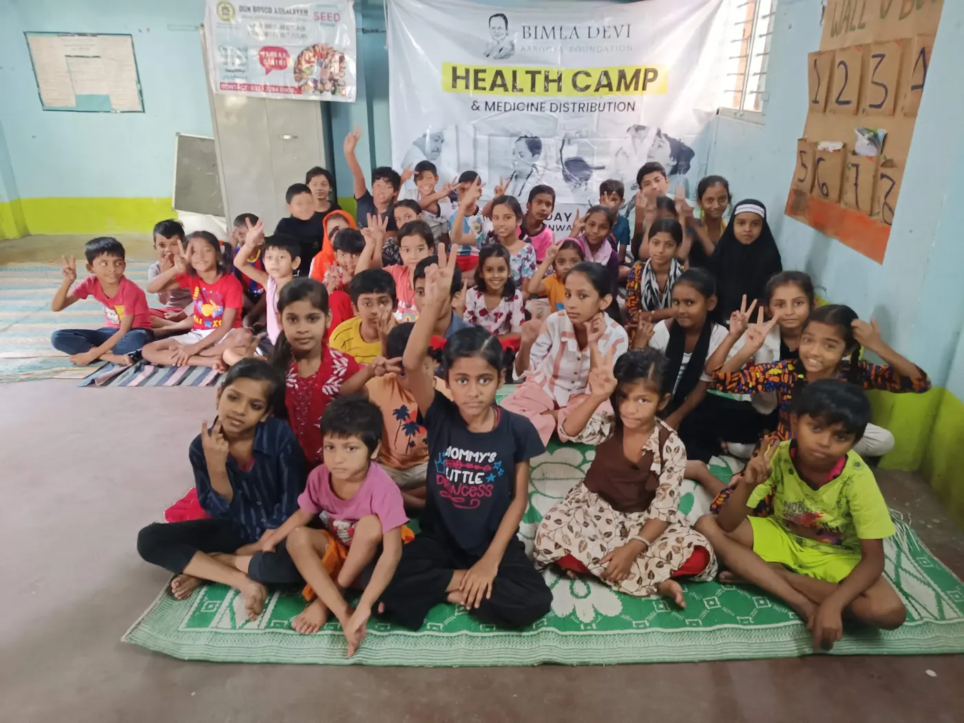 Children at a BDAF health camp and medicine distribution in Tangra
